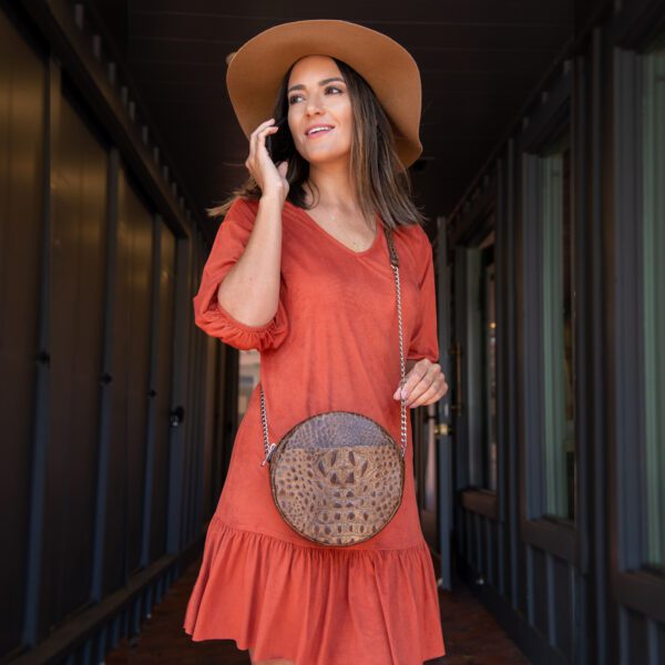 Women Wearing a Brown Circle Shaped Purse Front