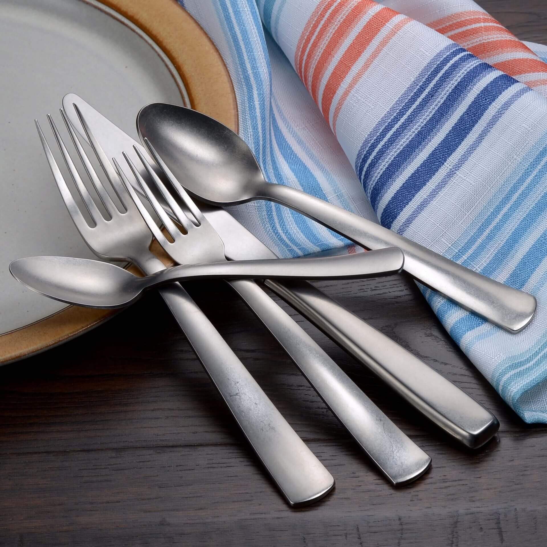 Stainless Steel Spoons, Fork and Butter Knife Bunch on a Table